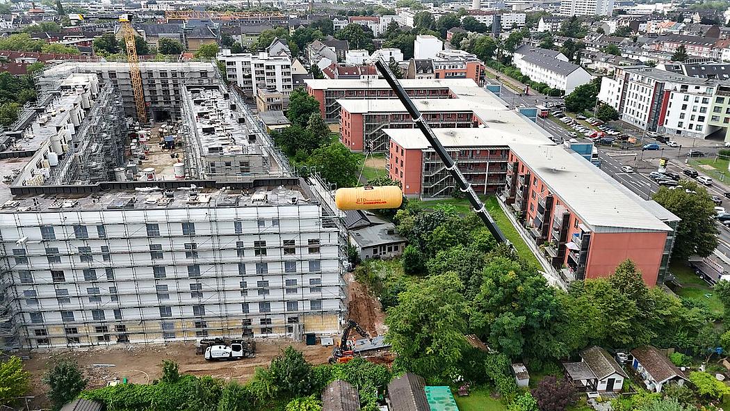 Luftaufnahme der Baustelle (von Häusern) und angrenzendem Gebiet